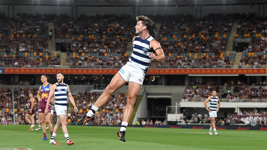 Geelong's Tom Hawkins watches his kick in the preliminary final against the Brisbane Lions.