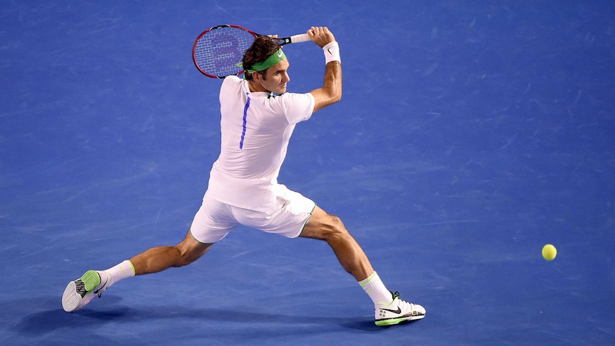 Roger Federer stretches for a backhand