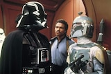 Darth Vader, Lando and Boba Fett having a conversation.