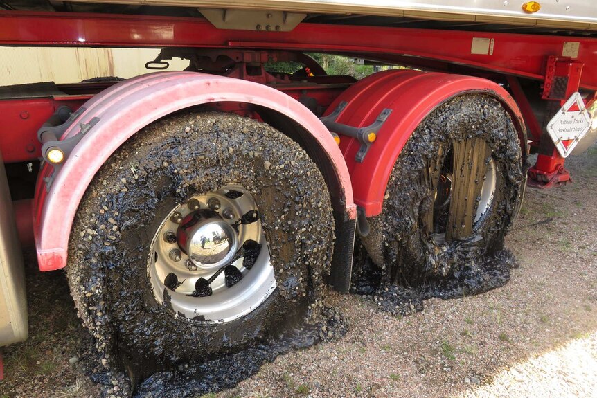 Melted bitumen around B-double tyres.