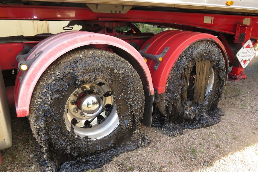 Melted bitumen around B-double tyres.