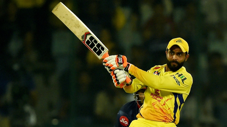 An IPL batsman stares down the wicket after hitting the ball on the onside. 