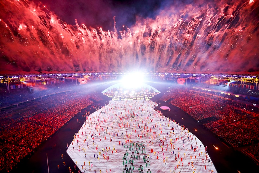 Rio's Maracana stadium lit up by red fire works during the Olympics opening ceremony