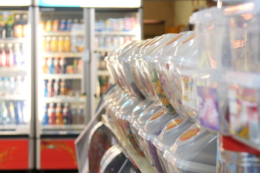 shelves of lollies in an old corner store