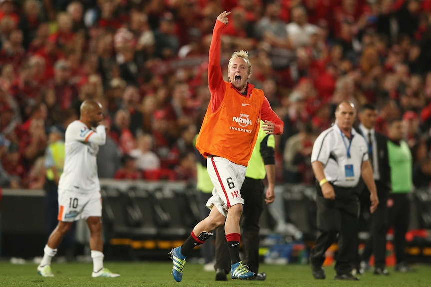 Mitch Nichols gestures to Brisbane Roar fans