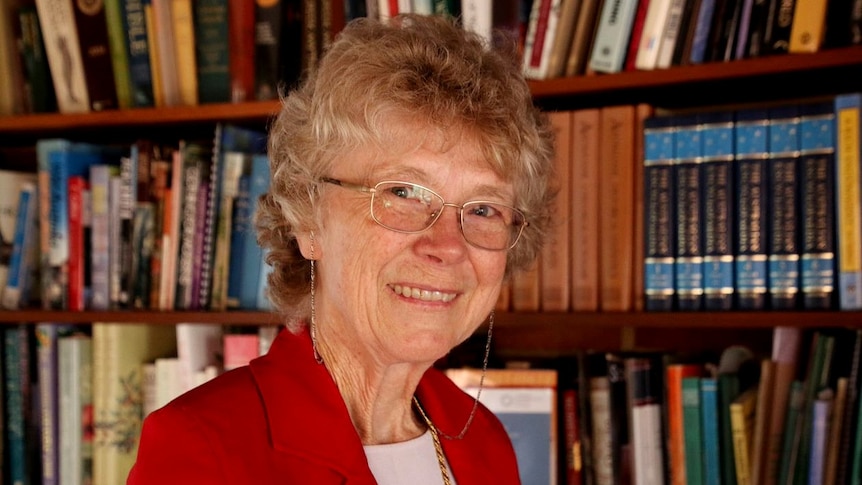 A photo of Cheryl Praeger, WA's first female mathematics professor, in front of a bookcase.