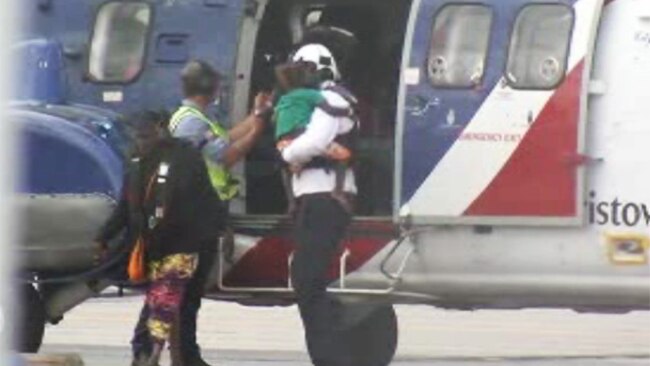 Evacuees from Cyclone Lam's path