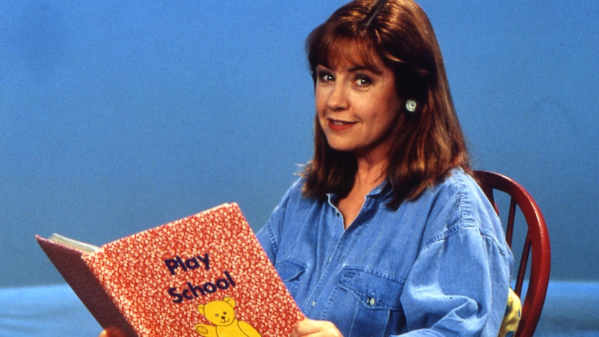 a young noni hazlehurst reading a play school book on the set of the children's show 