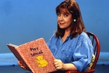 a young noni hazlehurst reading a play school book on the set of the children's show 