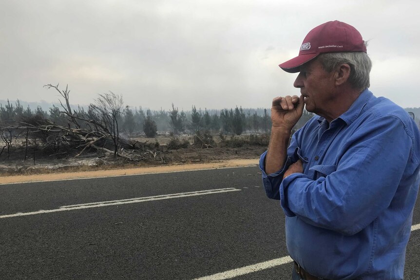 Richard Cooke surveys the damage after a fire in Victoria.
