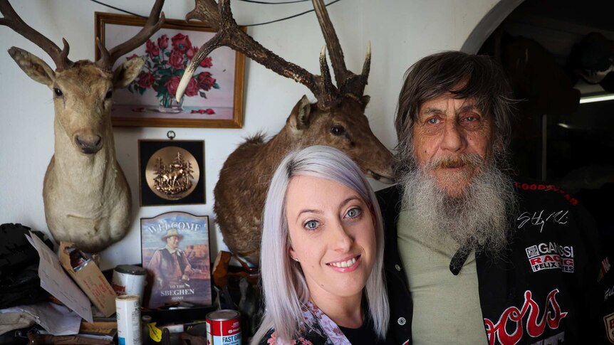 John with daughter Joleen Sbeghen, in his house with his large taxidermy collection.