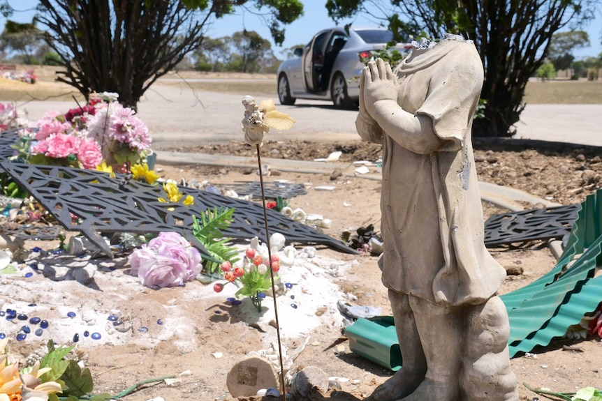 A headless statue with hands linked in prayer.