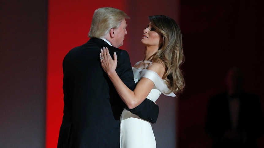Donald Trump and Melania Trump embrace each other in a dance