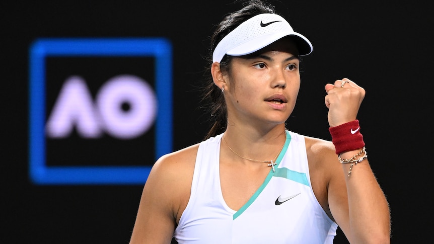 A British female tennis player pumps her left fist after winning a point at the Australian Open.