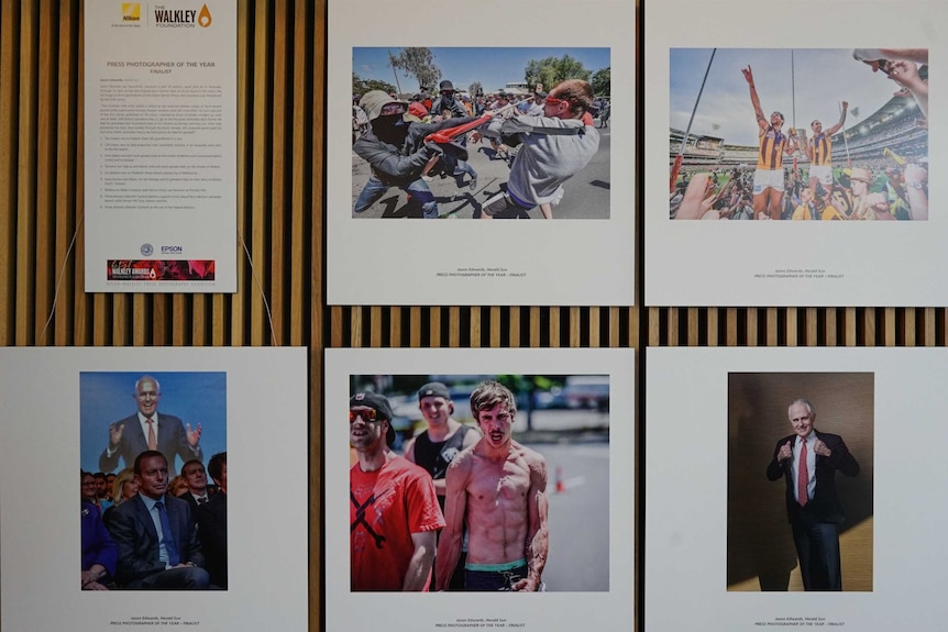 Finalists in the Nikon-Walkley photography awards hang in the ABC building in Brisbane.