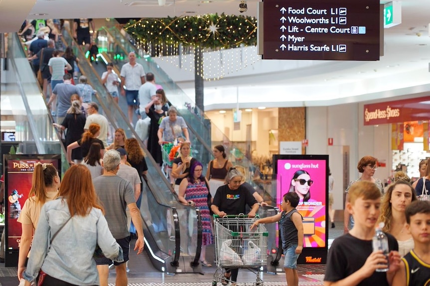 Escalators at Carindale shopping centre busy with Christmas shoppers
