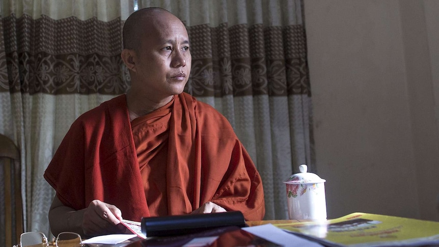 Myanmar's firebrand Buddhist monk Wirathu sits in a supporter's home.
