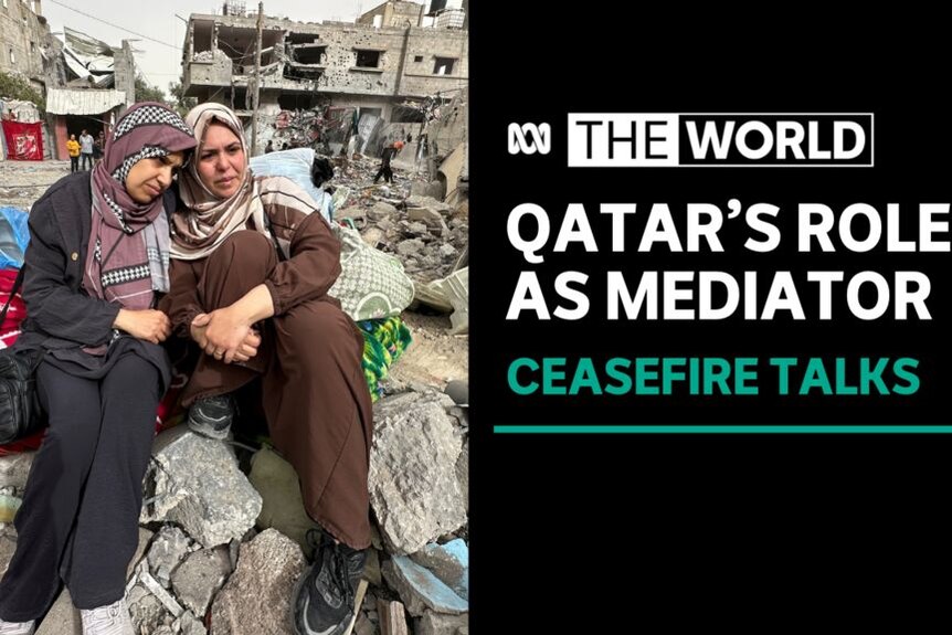 Qatar's Role As Mediator, Ceasefire Talks: Two women sit together alongside rubble.