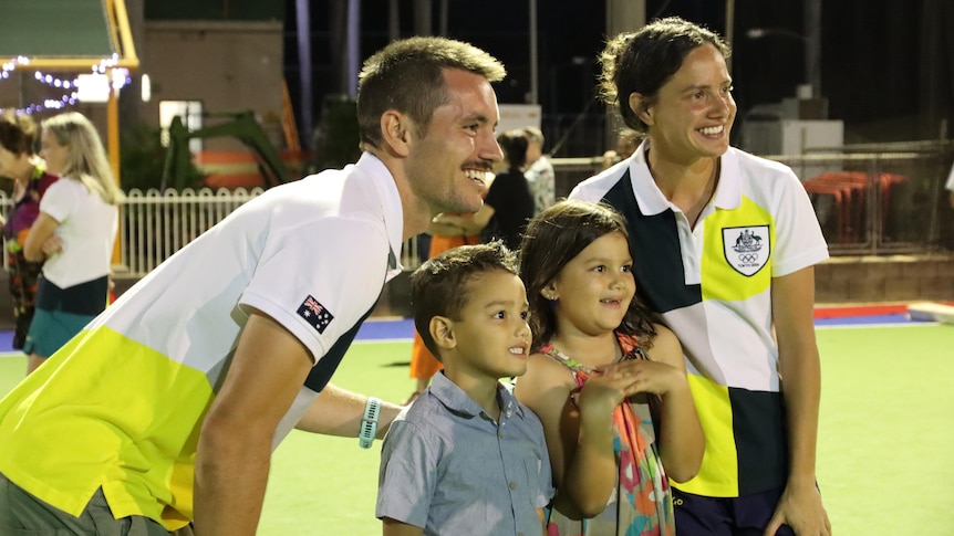 Brooke Peris and Jeremy Hayward  pose for a photo with young fans.