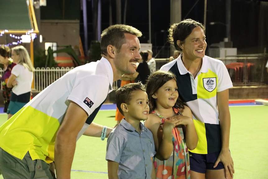 Brooke Peris and Jeremy Hayward  pose for a photo with young fans.