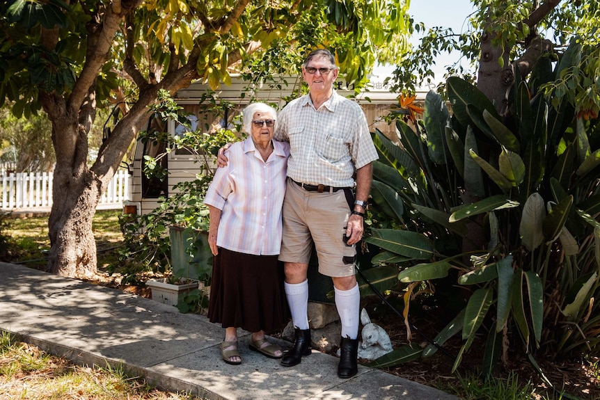 Kay and Bob standing in their garden.