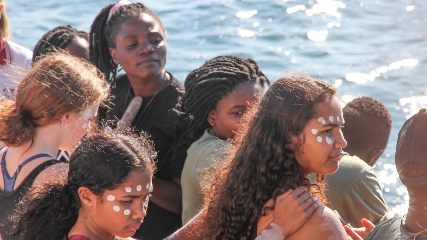 UBUNTU African choir and Vincentia High School children on a boat in Jervis Bay
