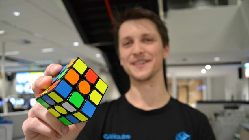 Rubik's cube champion Felix Zemdegs holds a Rubik's cube.