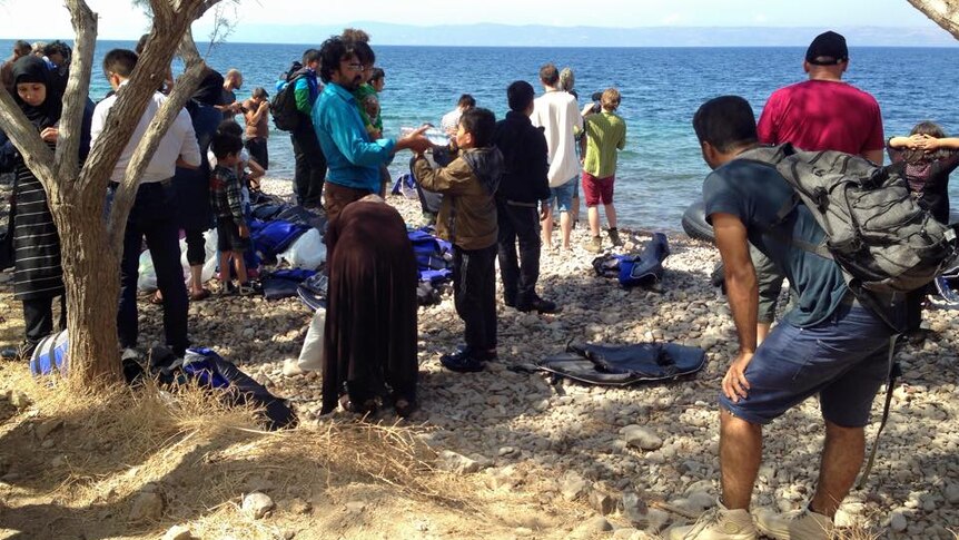Asylum seekers on a Lesbos beach