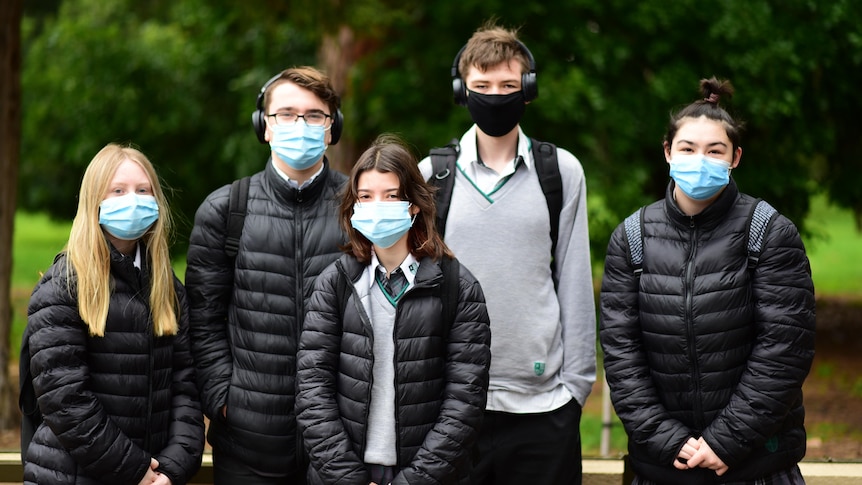 A group of students from Adelaide Botanic High School wearing face masks.