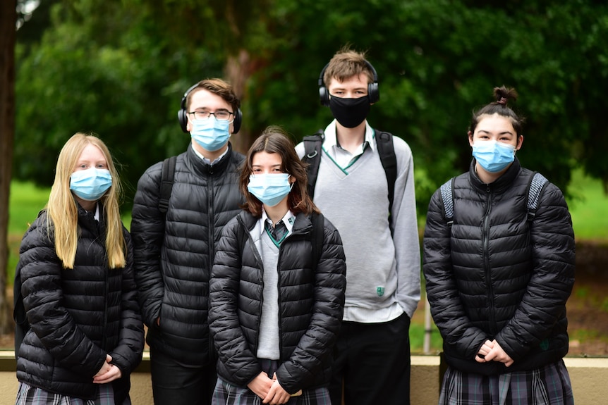 A group of students from Adelaide Botanic High School wearing face masks.