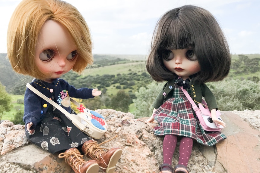 Two dolls in the countryside