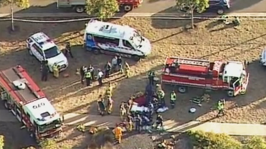 Dozen of emergency service workers attending the scene where a car went into a lake in Wyndham Vale, in Melbourne's outer west.