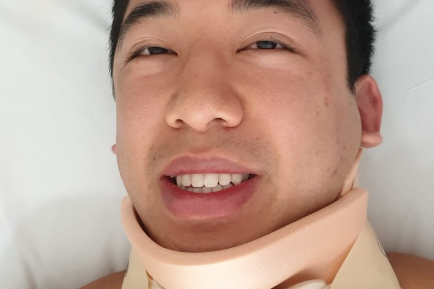 Acrobatic performer Anthony Tran in a neck brace.