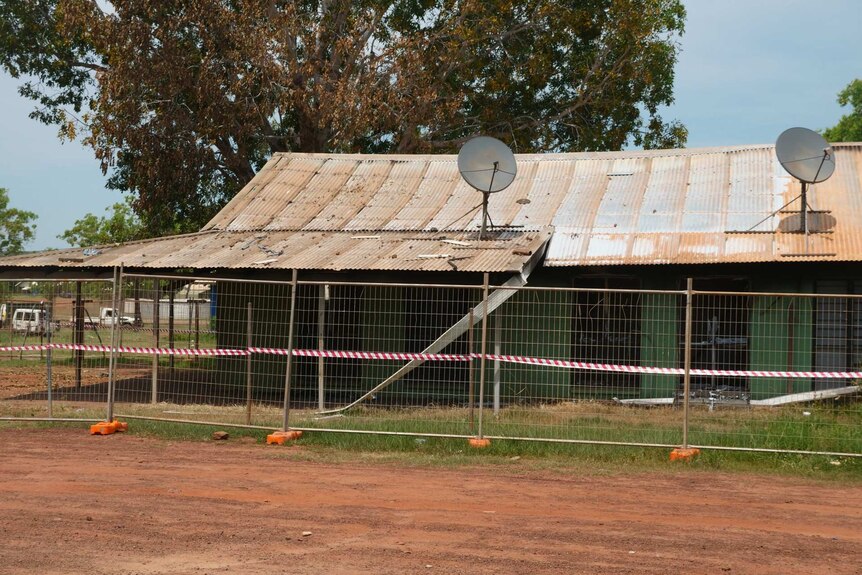 A  photo of a severely damaged house in the remote community of Wadeye.
