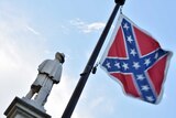 The Confederate flag is seen next to the monument of the victims of the Civil War in Columbia, South Carolina