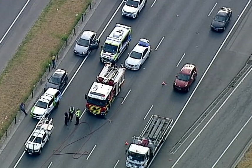 A fire truck and ambulance parked on the Monash Freeway, pictured from above.