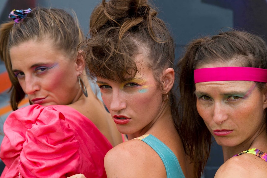 Dancers pout at the camera