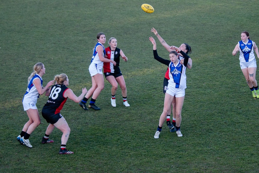 Women play Aussie rules.