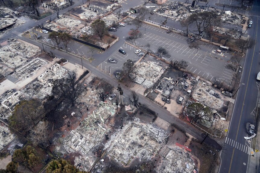 An aerial photo showing a town where all the buildings have been destroyed by fire.