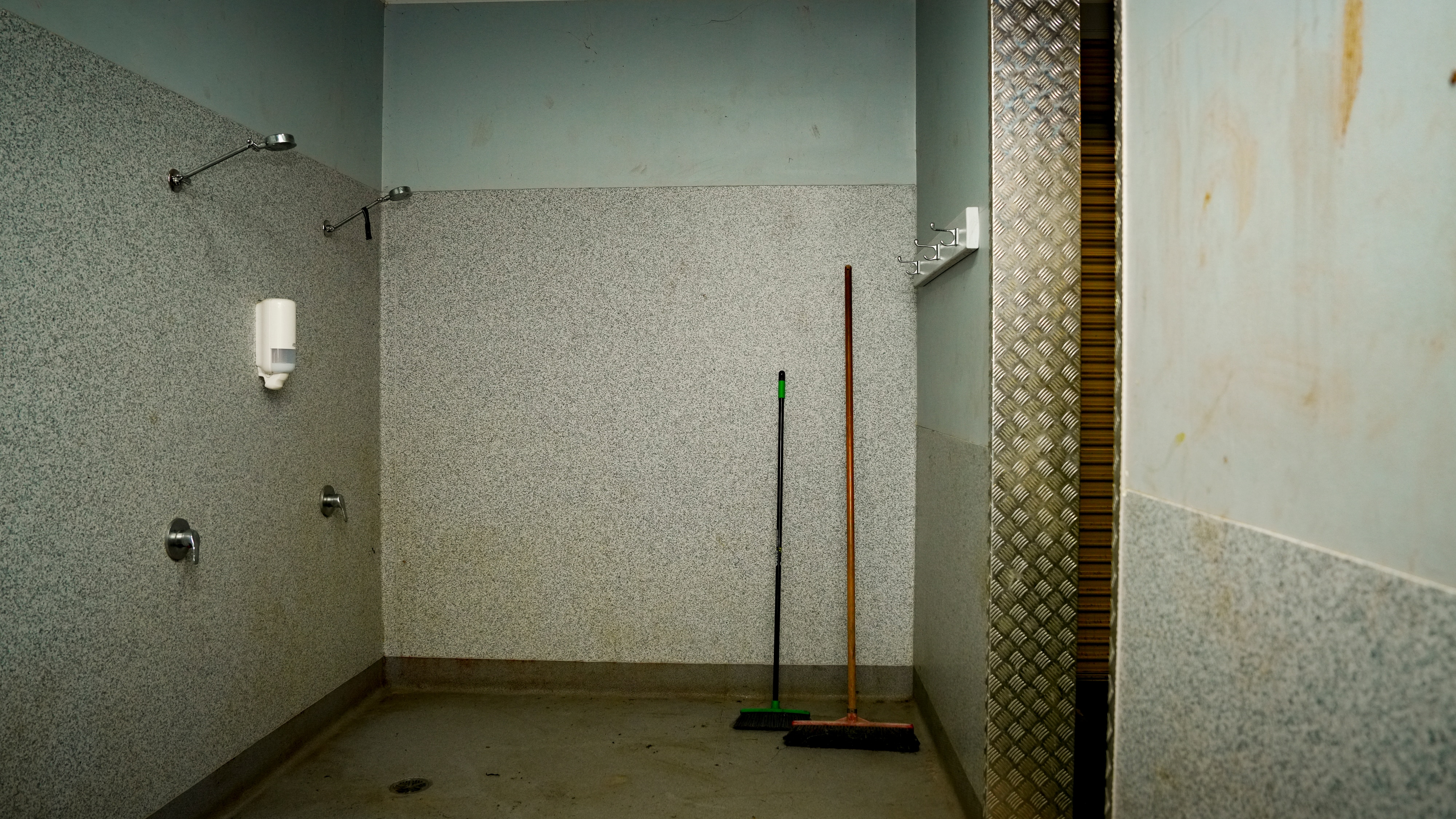 A bare shared shower room.