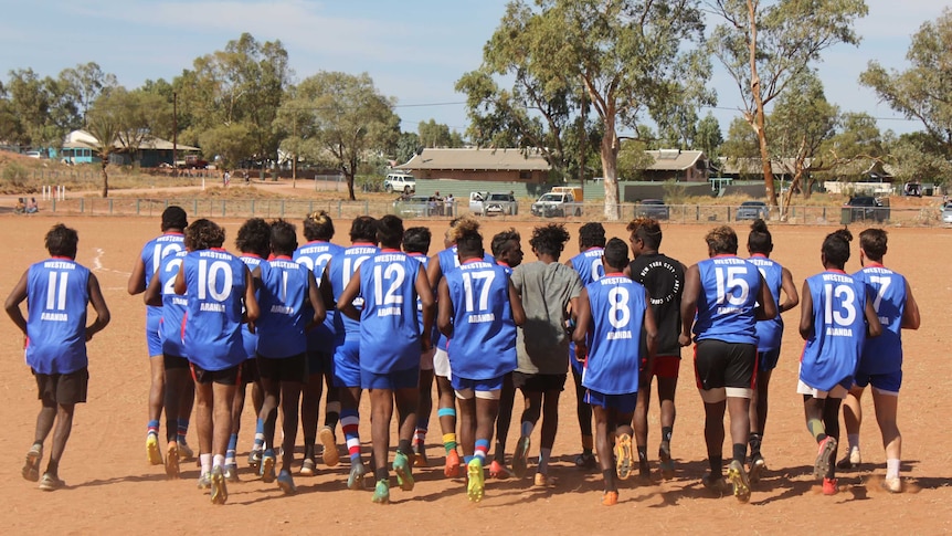 Footy players take to the field as part of the Hermannsburg sports weekend.