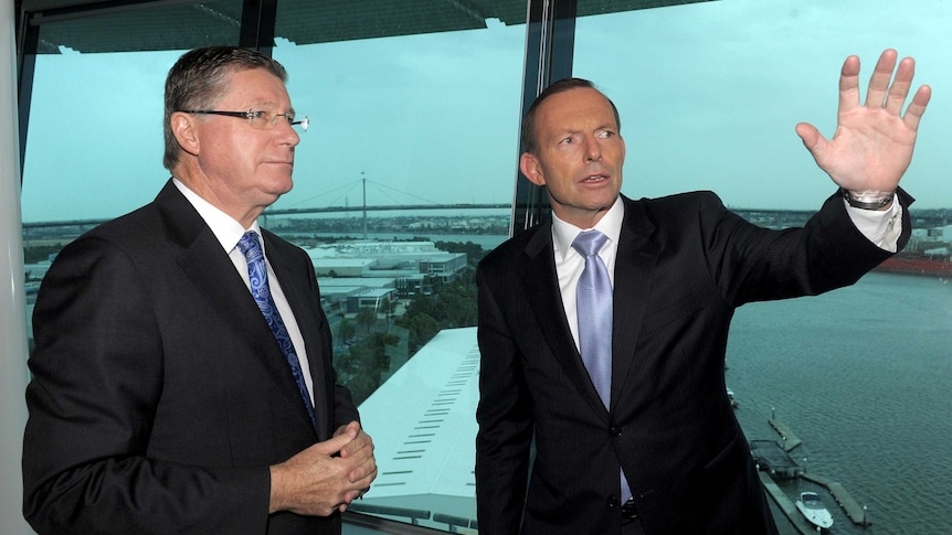 LtoR Denis Napthine and Tony Abbott speak whilst visiting the Port Of Melbourne control tower.