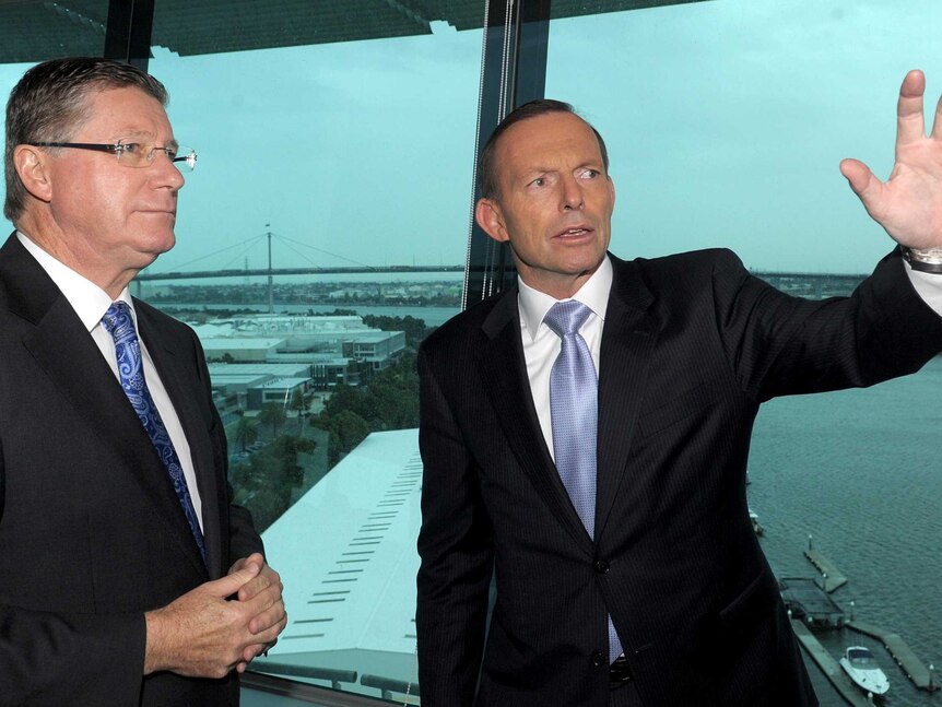 Denis Napthine and Prime Minister Tony Abbott speak whilst visiting the Port Of Melbourne in April.