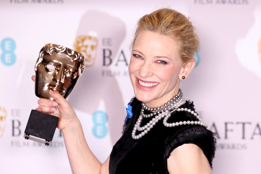 Cate Blanchett holds up her Bafta Award.