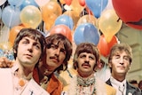 The Beatles pose in front of some colourful balloons around the time of the Sgt Pepper's album
