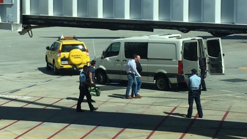 Frances John Wark arrives at the Perth domestic airport after being extradited from Queensland on December 16, 2015.