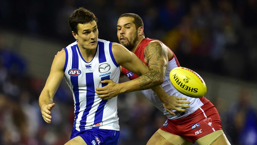 Scott Thompson and Lance Franklin contest the ball