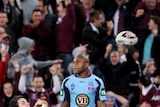 Queensland celebrates after Billy Slater's match-winning try.