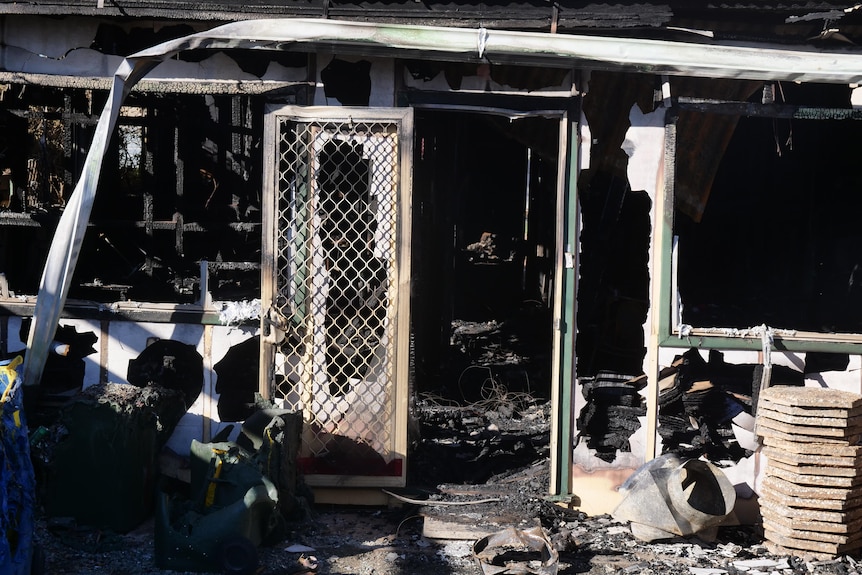 Close-up of a door in a burnt out house.