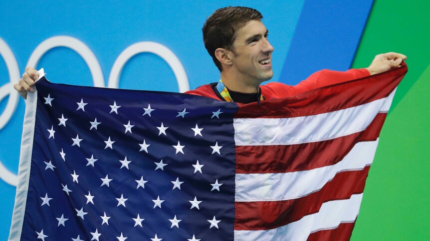 Michael Phelps celebrates winning his 23rd Olympic gold medal